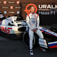 Nikita Mazepin and Mick Schumacher sit on the 2022 Haas F1 car